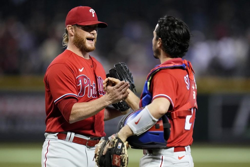 Philadelphia Phillies relief pitcher Craig Kimbrel, left, celebrates with catcher Garrett Stubbs after the final out in the team's 5-4 win in a baseball game against the Arizona Diamondbacks on Thursday, June 15, 2023, in Phoenix. (AP Photo/Ross D. Franklin)