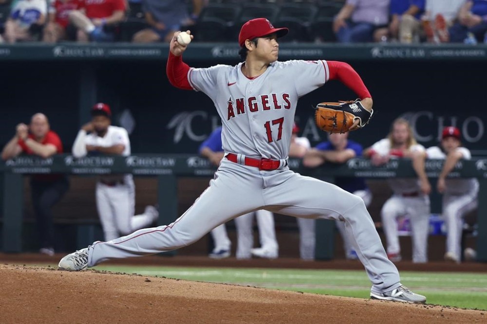 Los Angeles Angels starting pitcher Shohei Ohtani delivers a pitch in the first inning of the team's baseball game against the Texas Rangers on Thursday, June 15, 2023, in Arlington, Texas. (AP Photo/Richard W. Rodriguez)