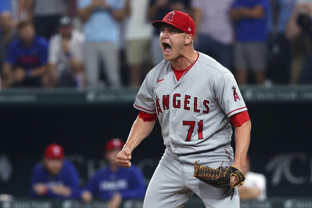 Los Angeles Angels relief pitcher Jacob Webb reacts after striking out Texas Rangers' Adolis Garcia for the final out of a baseball game Thursday, June 15, 2023, in Arlington, Texas. (AP Photo/Richard W. Rodriguez)