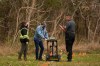 Community members, joined by Six Nations Police, conduct a search for unmarked graves using ground-penetrating radar on the 500 acres of the lands associated with the former Indian Residential School, the Mohawk Institute, in Brantford, Ont., Tuesday, Nov. 9, 2021. Indigenous communities searching for unmarked graves have seen a rise in individuals denying the disappearances and deaths of Indigenous children in the residential school system, according to a new report from the federal government's special interlocutor on unmarked graves. THE CANADIAN PRESS/Nick Iwanyshyn