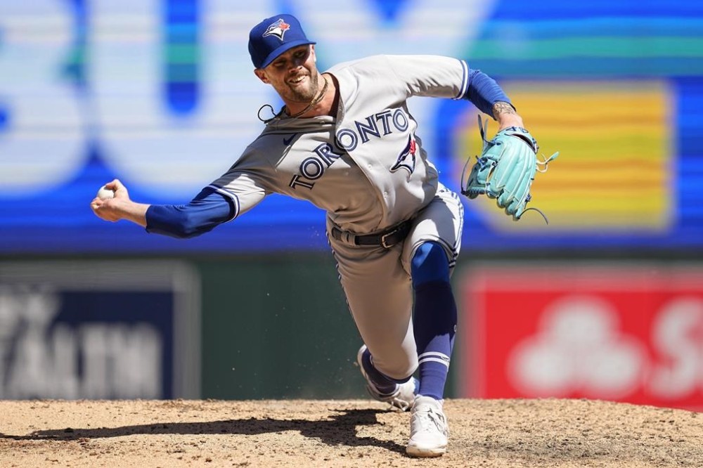 Toronto Blue Jays relief pitcher Adam Cimber delivers during the seventh inning of a baseball game against the Minnesota Twins, in Minneapolis, Saturday, May 27, 2023. Toronto Blue Jays reliever Adam Cimber was reinstated from the paternity list ahead of Friday night's game against the Texas Rangers. THE CANADIAN PRESS/AP-Abbie Parr