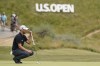 Wyndham Clark lines up a putt on the fourth hole during the second round of the U.S. Open golf tournament at Los Angeles Country Club on Friday, June 16, 2023, in Los Angeles. (AP Photo/Marcio J. Sanchez)