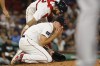 Boston Red Sox starting pitcher Tanner Houck touches his cheek after being struck by a line drive by New York Yankees' Kyle Higashioka during the fifth inning of a baseball game Friday, June 16, 2023, at Fenway Park in Boston. (AP Photo/Winslow Townson)