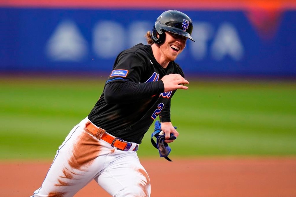 New York Mets' Brett Baty rounds third on the way to scoring on a single by Tommy Pham during the first inning of the team's baseball game against the St. Louis Cardinals on Friday, June 16, 2023, in New York. (AP Photo/Frank Franklin II)