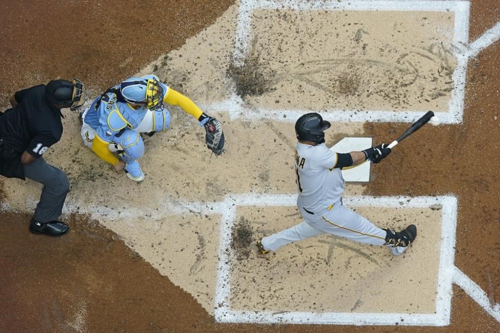 Pittsburgh Pirates' Carlos Santana hits a home run during the second inning of a baseball game against the Milwaukee Brewers Friday, June 16, 2023, in Milwaukee. (AP Photo/Morry Gash)