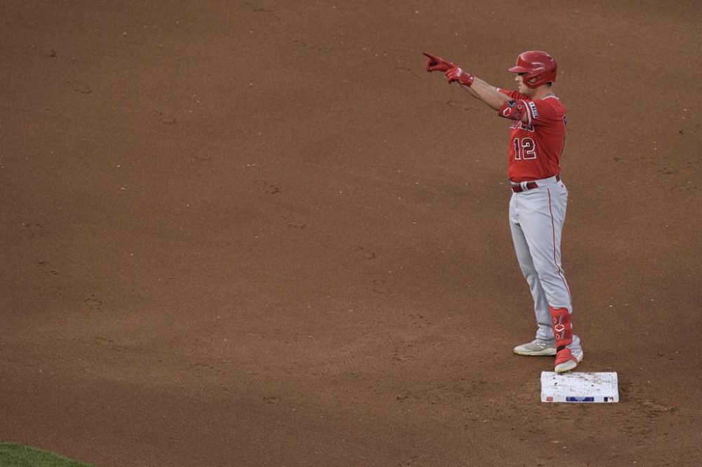 Los Angeles Angels' Hunter Renfroe celebrates on second after hitting a double during the fourth inning of a baseball game against the Kansas City Royals Friday, June 16, 2023, in Kansas City, Mo. (AP Photo/Charlie Riedel)