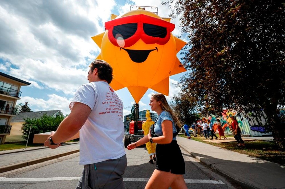 Residents of the Sunnyside neighborhood attend a parade and party marking the 10-year anniversary of the Southern Alberta floods in Calgary, Saturday, June 17, 2023.THE CANADIAN PRESS/Jeff McIntosh