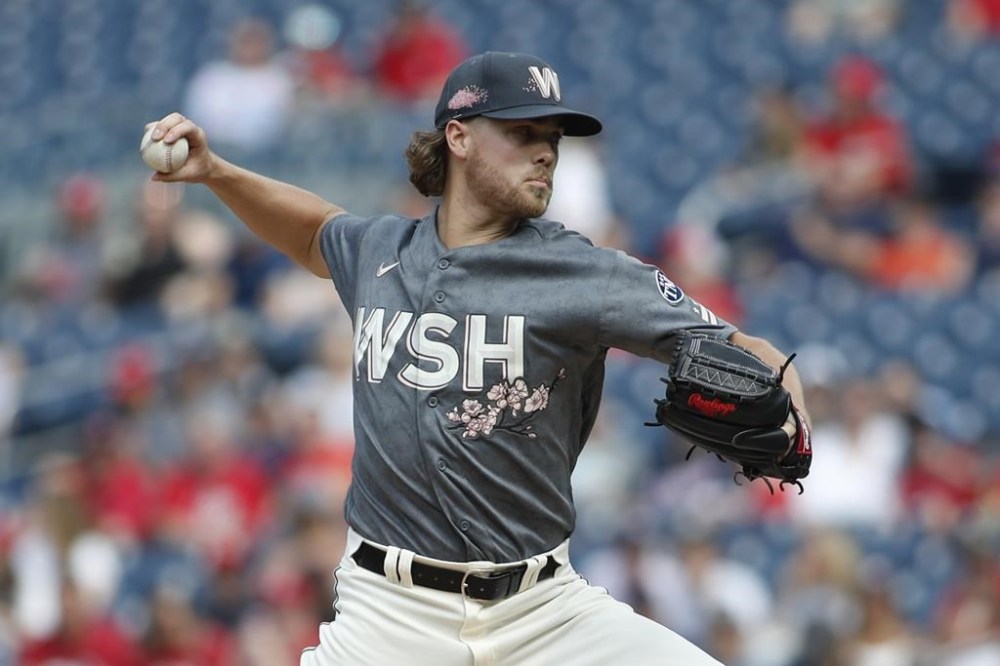 Washington Nationals pitcher Jake Irvin delivers the ball to the Miami Marlins during the first inning of a baseball game Saturday, June 17, 2023, in Washington. (AP Photo/Luis M. Alvarez)