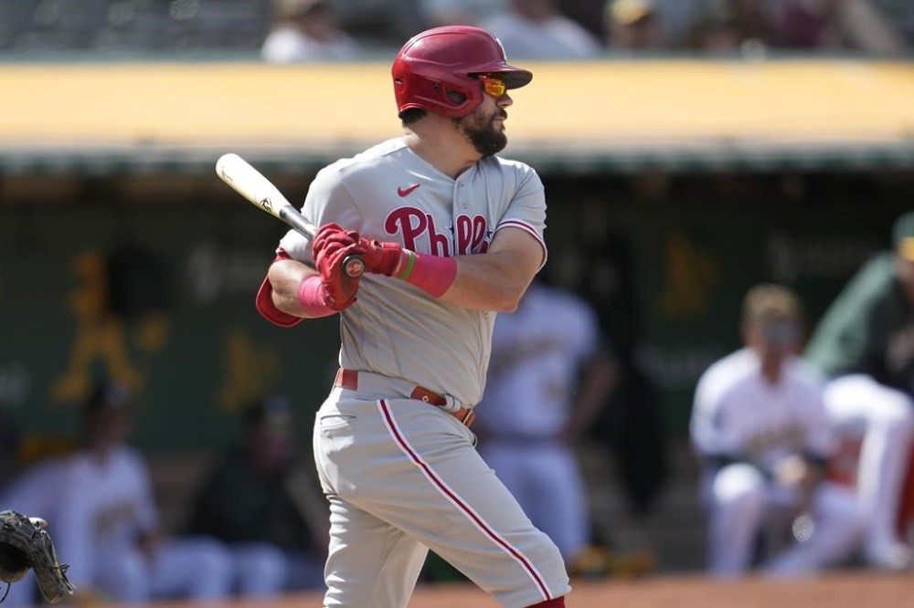 Philadelphia Phillies' Kyle Schwarber watches his RBI single against the Oakland Athletics during the 12th inning of a baseball game in Oakland, Calif., Saturday, June 17, 2023. (AP Photo/Jeff Chiu)
