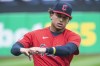 FILE - Cleveland Guardians' Bo Naylor warms up before the team's baseball game against the Kansas City Royals in Cleveland, Oct. 2, 2022. The Guardians called up catching prospect Naylor on Saturday, June 17, one day after they designated Mike Zunino for assignment. (AP Photo/Phil Long)