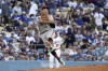 San Francisco Giants third baseman Casey Schmitt attempts to throw out Los Angeles Dodgers' Jonny Deluca at first during the second inning of a baseball game Saturday, June 17, 2023, in Los Angeles. Deluca was safe at first on the play. (AP Photo/Mark J. Terrill)