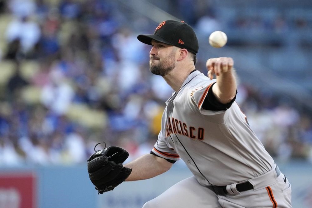 San Francisco Giants starting pitcher Alex Wood throws to the plate during the first inning of a baseball game against the Los Angeles Dodgers Saturday, June 17, 2023, in Los Angeles. (AP Photo/Mark J. Terrill)