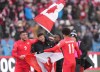 Canada players, left to right, Lucas Cavallini, Jonathan Osorio, Richie Laryea and Tajon Buchanan celebrate their 4-0 win over Jamaica during second half CONCACAF World Cup soccer qualifying action in Toronto on Sunday, March 27, 2022. Lucas Cavallini and Jonathan Osorio have come a long way since the days of playing soccer as kids in the Cavallini family family basement in Mississauga, Ont.&nbsp;THE CANADIAN PRESS/Nathan Denette