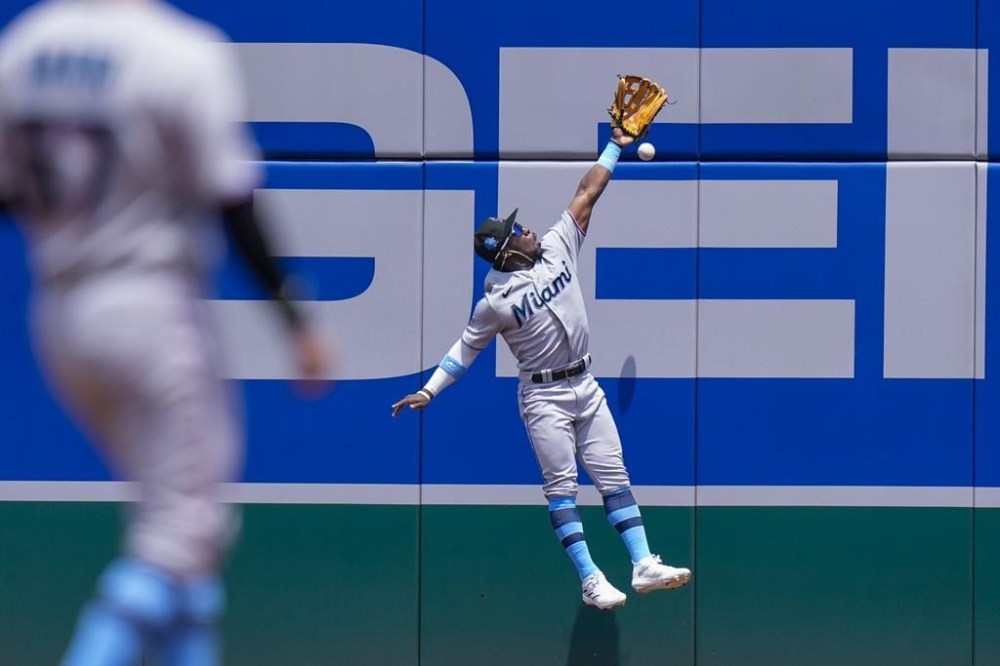Miami Marlins center fielder Jonathan Davis cant's catch a hit by Washington Nationals' Joey Meneses for a double during the first inning of a baseball game at Nationals Park, Sunday, June 18, 2023, in Washington. (AP Photo/Alex Brandon)