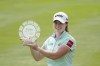 Leona Maguire holds the winner's trophy after the final round of the Meijer LPGA Classic golf tournament at Blythefield Country Club, Sunday, June 18, 2023, in Belmont, Mich. (AP Photo/Carlos Osorio)