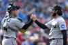 Miami Marlins catcher Nick Fortes, left, and relief pitcher Andrew Nardi celebrate after a baseball game against the Washington Nationals at Nationals Park, Sunday, June 18, 2023, in Washington. Marlins won 4-2. (AP Photo/Alex Brandon)