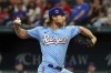 Texas Rangers starting pitcher Jon Gray delivers a pitch against the Toronto Blue Jays in the first inning of a baseball game, Sunday, June 18, 2023, in Arlington, Texas. (AP Photo/Richard W. Rodriguez)