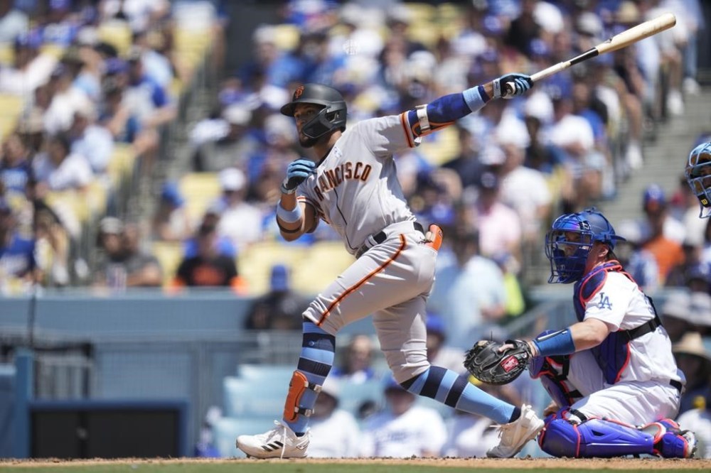 San Francisco Giants’ Luis Matos (29) doubles during the sixth inning of a baseball game against the Los Angeles Dodgers in Los Angeles, Sunday, June 18, 2023. Michael Conforto and Mike Yastrzemski scored. (AP Photo/Ashley Landis)