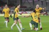 FILE - Australia's Sam Kerr, second right, celebrates with teammates after scoring against England during their women's international friendly soccer match in London, England, April 11, 2023. A 29-strong preliminary squad, announced on Monday, June 19, 2023, will go into a training camp on the Gold Cost before heading to Melbourne for the final squad announcement and a match against France on July 14. The World Cup, co-hosted by Australia and New Zealand, begins on July 20. (AP Photo/Kin Cheung. File)