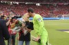 Belgium's goalkeeper Thibaut Courtois, right, kisses kisses his fiance and Israeli model Mishel Gerzig as he celebrates his 100th match during the Euro 2024 group F qualifying soccer match between Belgium and Austria at the King Baudouin Stadium in Brussels, Saturday, June 17, 2023. (AP Photo/Geert Vanden Wijngaert)