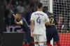 France's Kylian Mbappe, left, celebrates after scoring the opening goal by a penalty shoot during the Euro 2024 group B qualifying soccer match between France and Greece at the Stade de France, outside Paris, Monday, June 19, 2023. (AP Photo/Christophe Ena)
