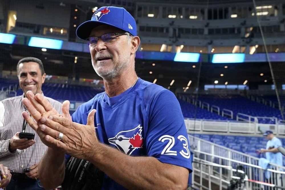Toronto Blue Jays bench coach Don Mattingly (23) speaks with the news media before a baseball game against the Miami Marlins, Monday, June 19, 2023, in Miami. Mattingly was the former manager for the Marlins. (AP Photo/Lynne Sladky)