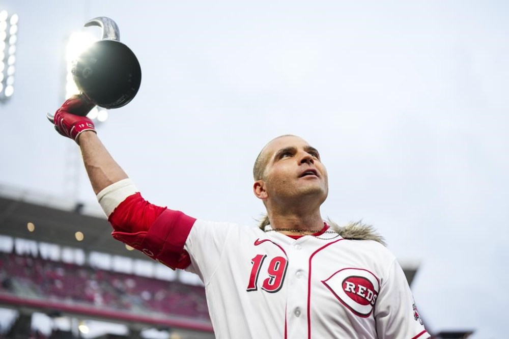 Cincinnati Reds' Joey Votto acknowledges fans after hitting a solo home run during the fifth inning of a baseball game against the Colorado Rockies in Cincinnati, Monday, June 19, 2023. (AP Photo/Aaron Doster)