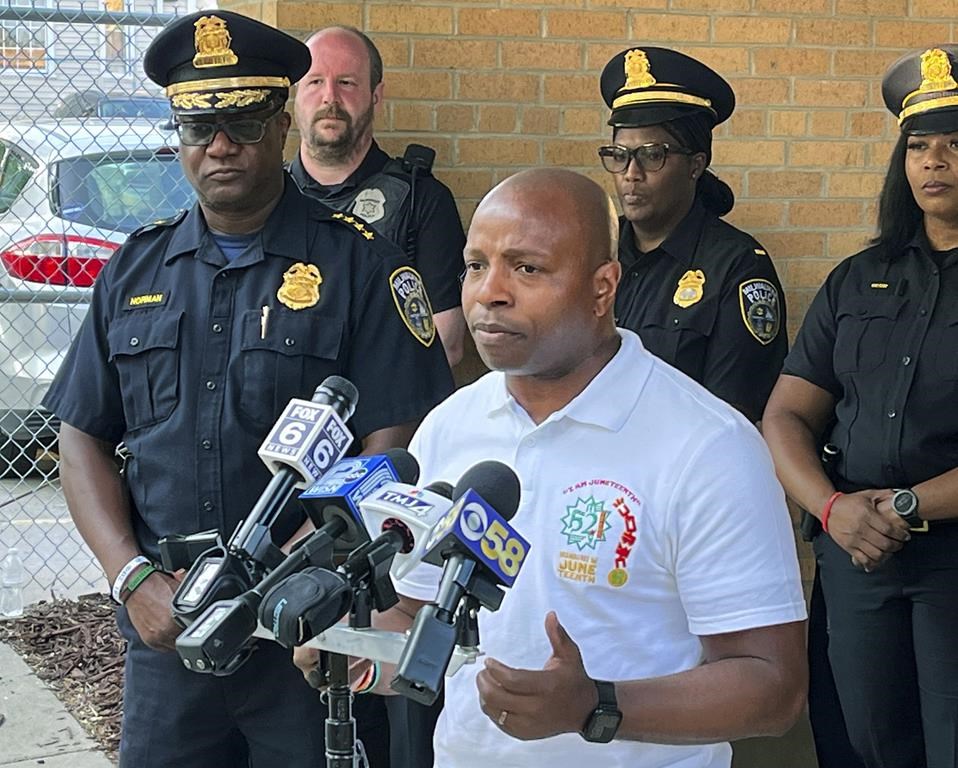 Milwaukee Mayor Cavalier Johnson speaks during a news conference outside the Milwaukee Police Department District 5 station, in Milwaukee, Monday, June 19, 2023, as police Chief Jeffrey Norman stands next to him, at left. At least six people were shot Monday afternoon around where Milwaukee’s Juneteenth celebration had just wrapped up, according to Milwaukee police and fire officials. (Bill Glauber/Milwaukee Journal-Sentinel via AP)