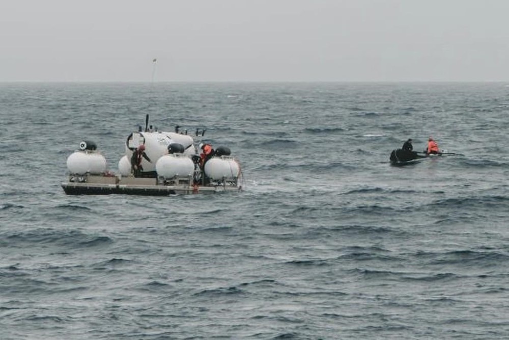 In this photograph released by Action Aviation, the submersible Titan is set to dive into the Atlantic Ocean on an expedition to the Titanic on Sunday, June 18, 2023. An air and sea search continues today in the remote area of ocean south of Newfoundland for a submersible carrying five people that went missing during a dive on the wreckage of the Titanic. THE CANADIAN PRESS/AP-Action Aviation via AP