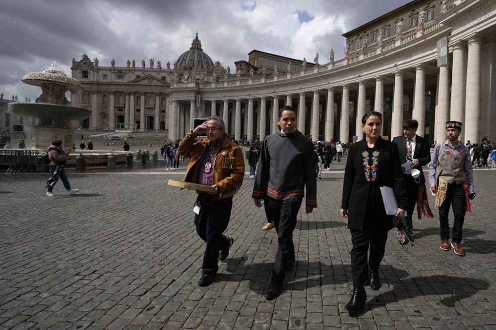 From left, Gerald Antoine, First Nations N.W.T. Regional Chief, Natan Obed, president of Inuit Tapiriit Kanatami delegation, and Cassidy Caron, president of the Metis community, walk in St. Peter's Square at the Vatican, after their meeting with Pope Francis, Friday, April 1, 2022. THE CANADIAN PRESS/AP-Alessandra Tarantino