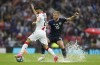 Scotland's Ryan Porteous, right, and Georgia's Georges Mikautadze battle for the ball during the Euro 2024 Qualifying Group A soccer match between Scotland and Georgia at Hampden Park, Glasgow, Scotland, Tuesday, June 20, 2023. (Andrew Milligan/PA via AP)