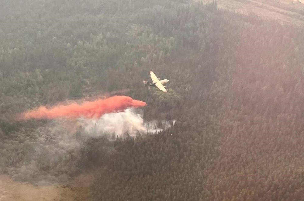 Airtankers work on a wildfire near Edson, Alta., in a Friday, June 9, 2023, handout photo. The mayor of Yellowhead County in west central Alberta says it's been