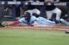 Toronto Blue Jays' Santiago Espinal scores on a single by Ernie Clement against the Miami Marlins during the eighth inning of a baseball game Tuesday, June 20, 2023, in Miami. (AP Photo/Lynne Sladky)