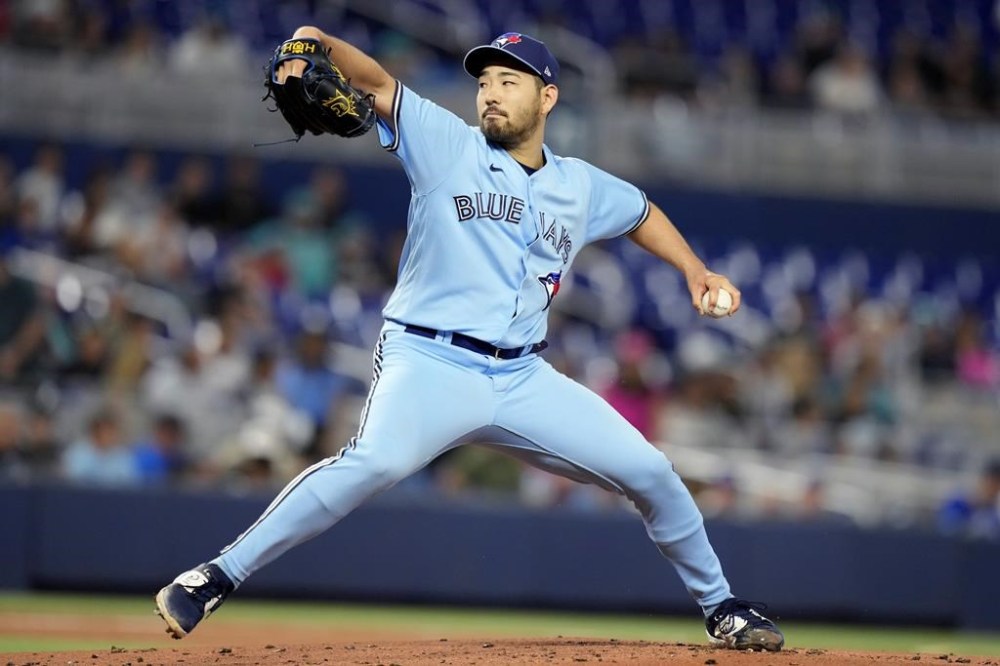 Toronto Blue Jays starting pitcher Yusei Kikuchi winds up during the first inning of the team's baseball game against the Miami Marlins, Tuesday, June 20, 2023, in Miami. (AP Photo/Lynne Sladky)