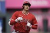 Los Angeles Angels' Shohei Ohtani, from Japan, celebrates as he runs the bases after hitting a solo home run during the seventh inning of a baseball game against the Kansas City Royals Saturday, June 17, 2023, in Kansas City, Mo. (AP Photo/Charlie Riedel)