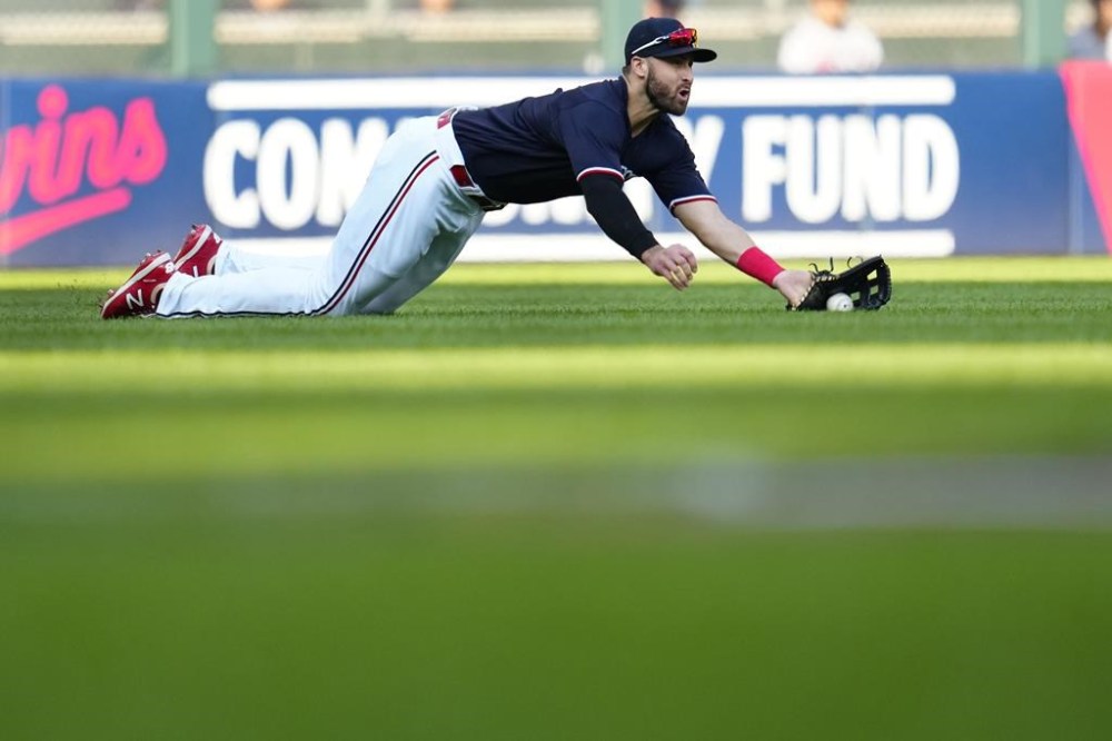 Minnesota Twins left fielder Joey Gallo cannot make the catch on a single by Boston Red Sox's Justin Turner during the first inning of a baseball game Tuesday, June 20, 2023, in Minneapolis. (AP Photo/Abbie Parr)
