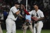 Chicago White Sox third baseman Jake Burger, left, celebrates with second baseman Jose Rodriguez after the team's 7-6 win over the Texas Rangers in a baseball game in Chicago, Tuesday, June 20, 2023. (AP Photo/Nam Y. Huh)