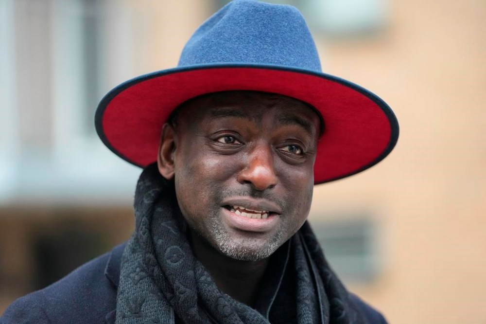 FILE - Yusef Salaam, one of the falsely imprisoned teenagers in the 1989 Central Park jogger case, speaks during a news interview while getting petition signatures for his campaign for New York City Council's 9th District, March 1, 2023, in New York. Some consider Salaam a folk hero as member of the “Central Park Five,” the group of teenagers wrongly convicted of raping a white jogger 34 years ago. Now he is banking on his painful past to help win a seat on the New York City Council. (AP Photo/Frank Franklin II, File)