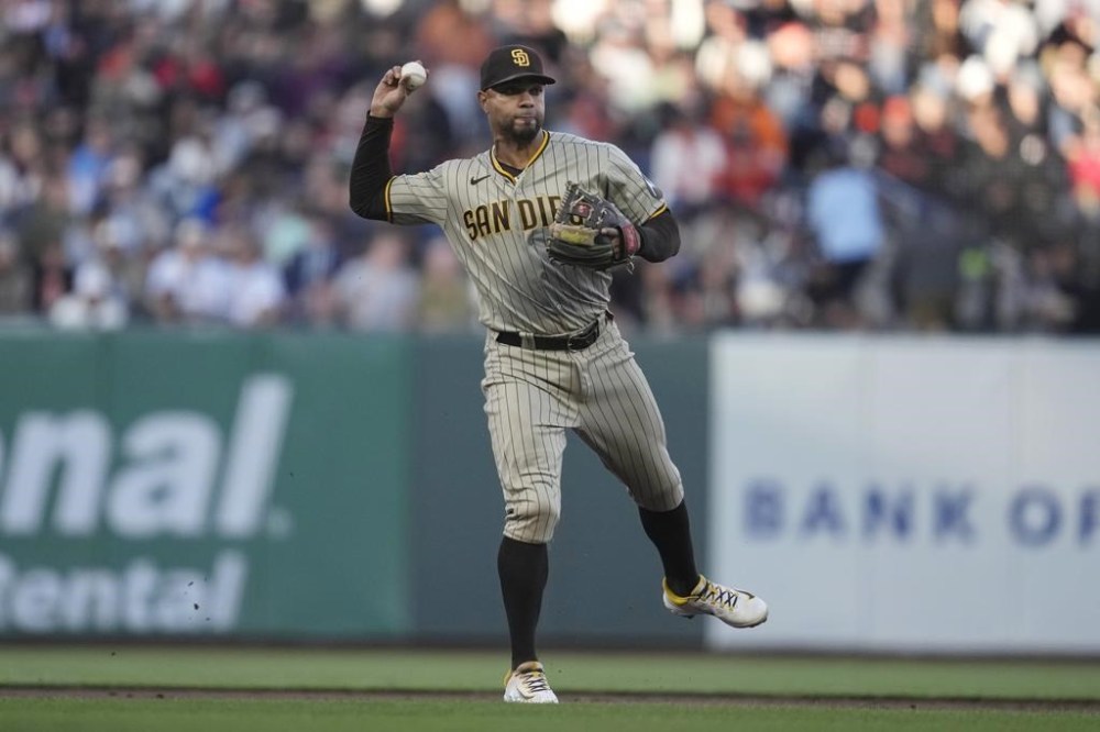 San Diego Padres shortstop Xander Bogaerts throws out San Francisco Giants' Michael Conforto at first base during the second inning of a baseball game in San Francisco, Tuesday, June 20, 2023. (AP Photo/Jeff Chiu)