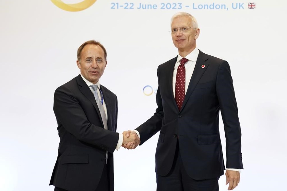 Thomas Drew, Director General, Defence & Intelligence at the Foreign, Commonwealth & Development Office (FCDO), left, welcomes Prime Minister of Latvia Edgars Rinkevics, at the Ukraine Recovery Conference, in east London, Wednesday, June 21, 2023. (Stefan Rousseau/Pool Photo via AP)