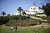 FILE - Players and caddies walk back to the clubhouse from the first hole after wind suspended play during the third round of the Genesis Invitational golf tournament at Riviera Country Club, Saturday, Feb. 20, 2021, in the Pacific Palisades area of Los Angeles. Riviera held the first U.S. Open in California in 1948 and finally will get another in 2031. (AP Photo/Ryan Kang, File)