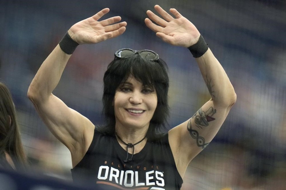 Singer Joan Jett waves to photographers during the first inning of a baseball game between the Tampa Bay Rays and the Baltimore Orioles Wednesday, June 21, 2023, in St. Petersburg, Fla. (AP Photo/Chris O'Meara)