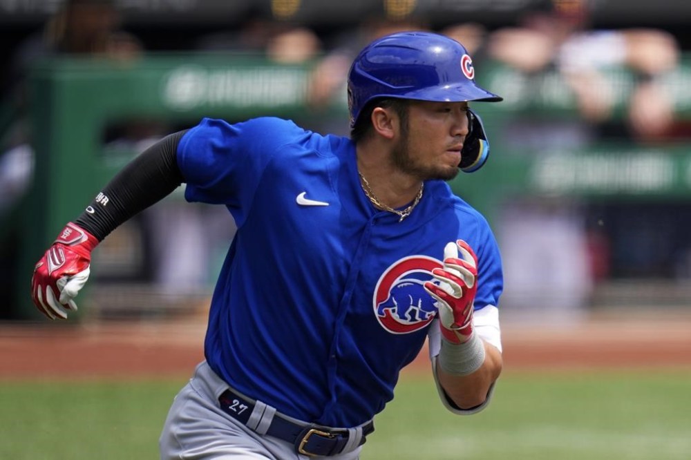 Chicago Cubs' Seiya Suzuki runs to first after hitting a single off Pittsburgh Pirates starting pitcher Rich Hill during the first inning of a baseball game in Pittsburgh, Wednesday, June 21, 2023. (AP Photo/Gene J. Puskar)