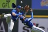 Kansas City Royals left fielder Samad Taylor (0) and right fielder Matt Beaty collide as they chase the tripe hit by Detroit Tigers' Spencer Torkelson during the eighth inning of a baseball game, Wednesday, June 21, 2023, in Detroit. (AP Photo/Carlos Osorio)