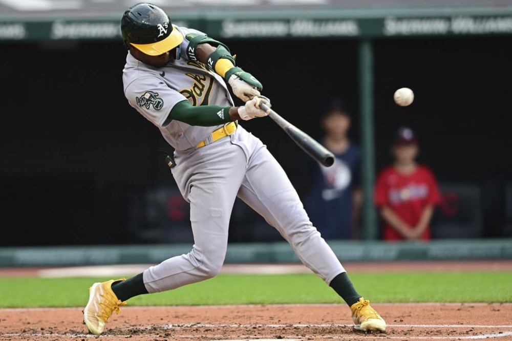 Oakland Athletics' Esteury Ruiz hits an RBI single against the Cleveland Guardians during the fourth inning of a baseball game Wednesday, June 21, 2023, in Cleveland. (AP Photo/David Dermer)