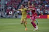 Real Salt Lake's Danny Musovski (17) and St. Louis City's Lucas Bartlett (24) chase after a loose ball during the first half of an MLS soccer match Wednesday, June 21, 2023, in St. Louis. (AP Photo/Jeff Roberson)