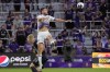 Orlando City's Duncan McGuire, right, heads the ball away from Philadelphia Union's Jakob Glesnes (5) during the first half of an MLS soccer match Wednesday, June 21, 2023, in Orlando, Fla. (AP Photo/John Raoux)