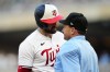 Minnesota Twins' Joey Gallo questions home plate umpire David Rackley after a called third strike during the fourth inning of the team's baseball game against the Boston Red Sox, Wednesday, June 21, 2023, in Minneapolis. (AP Photo/Abbie Parr)