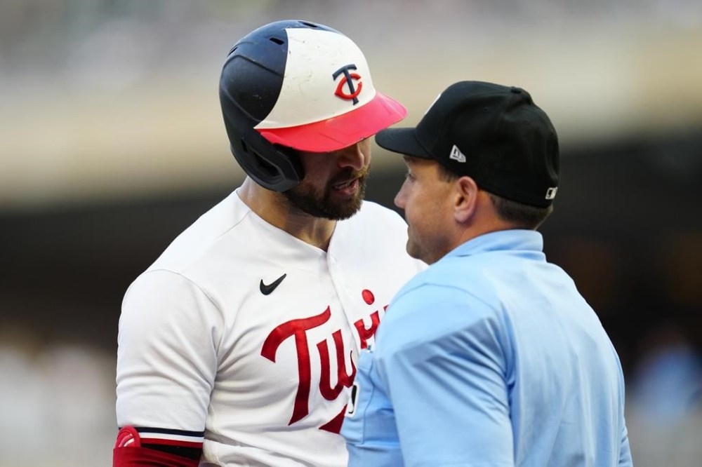 Minnesota Twins' Joey Gallo questions home plate umpire David Rackley after a called third strike during the fourth inning of the team's baseball game against the Boston Red Sox, Wednesday, June 21, 2023, in Minneapolis. (AP Photo/Abbie Parr)