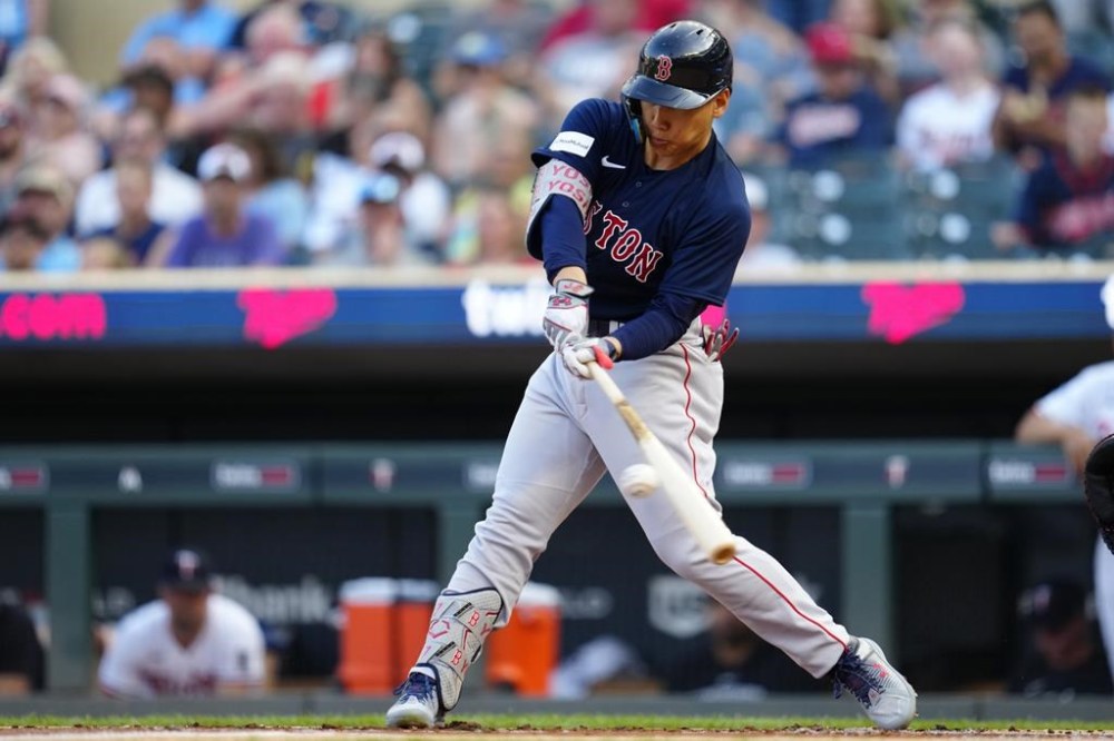 Boston Red Sox's Masataka Yoshida grounds out during the first inning of the team's baseball game against the Minnesota Twins, Wednesday, June 21, 2023, in Minneapolis. (AP Photo/Abbie Parr)